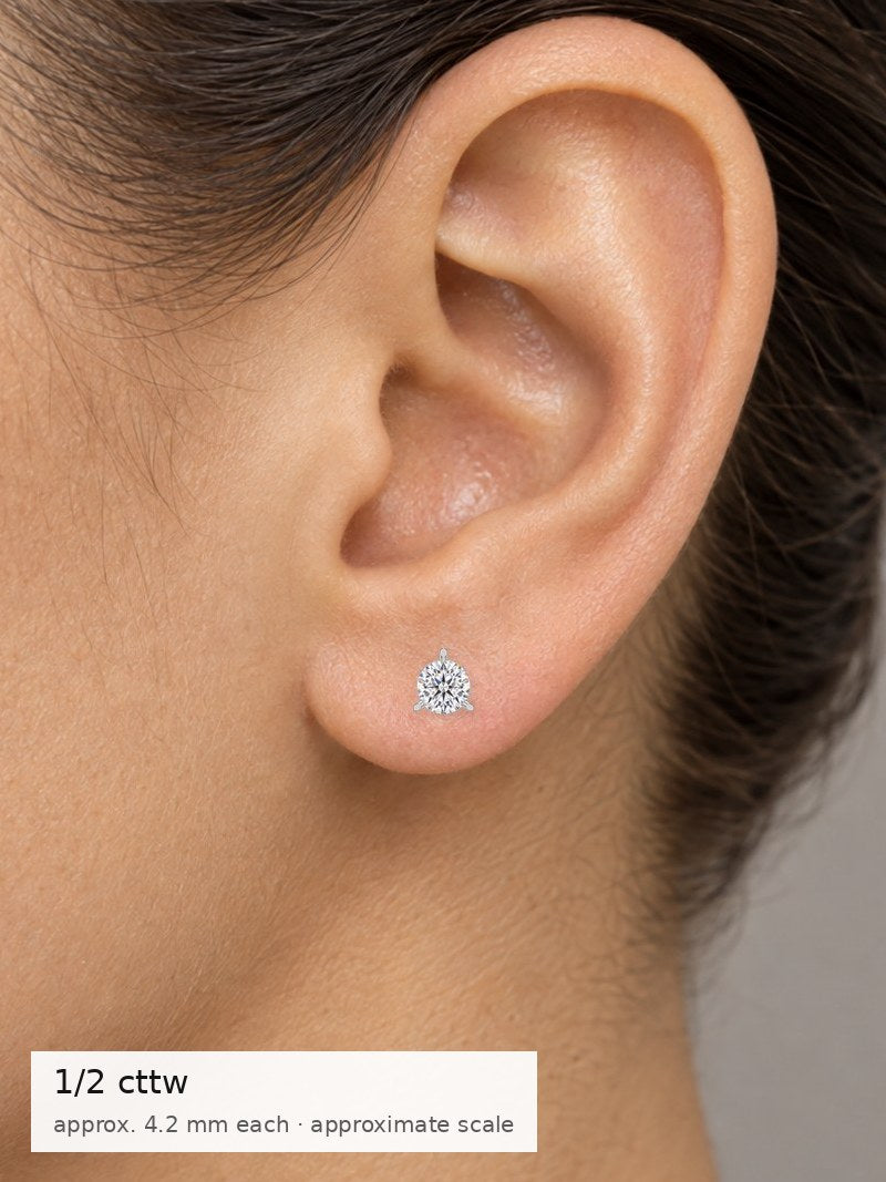 1/2 cttw (0.50–0.58) shown on the ear